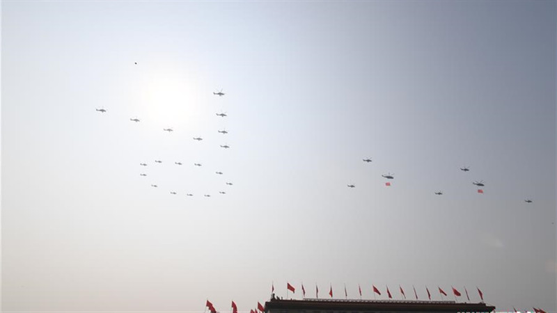 Military parade starts with flag-guarding echelon flying over Tian'anmen Square