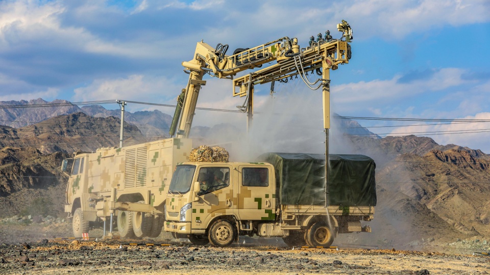 Decontamination vehicle engages in chemical defense training