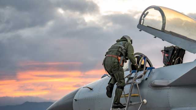 Pilot climbs into cockpit of J-10 fighter jet