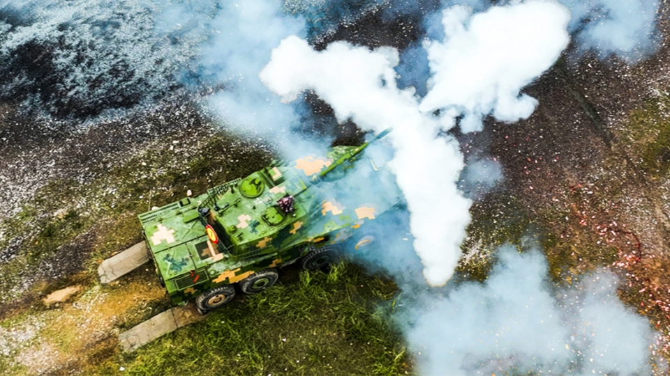 Armored vehicles fire in training