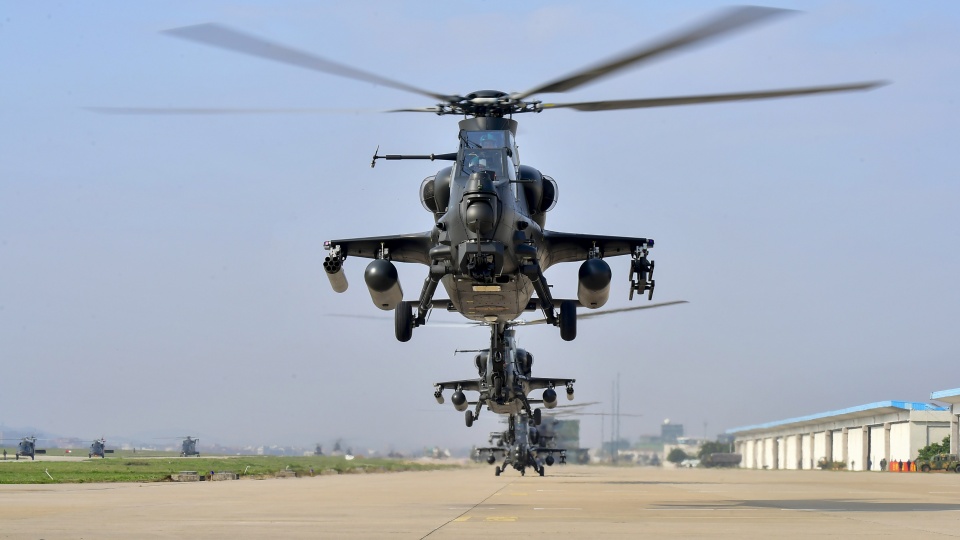 Multiple helicopters engage in flight training exercise