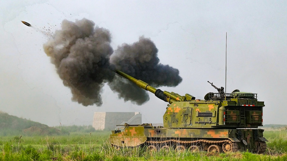 Heavy artillery spits fire at targets