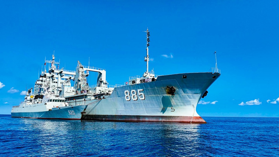 Warships conduct alongside replenishment 