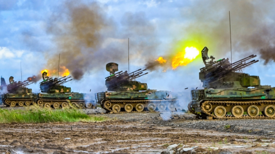 Anti-aircraft vehicles in live-fire tactical training