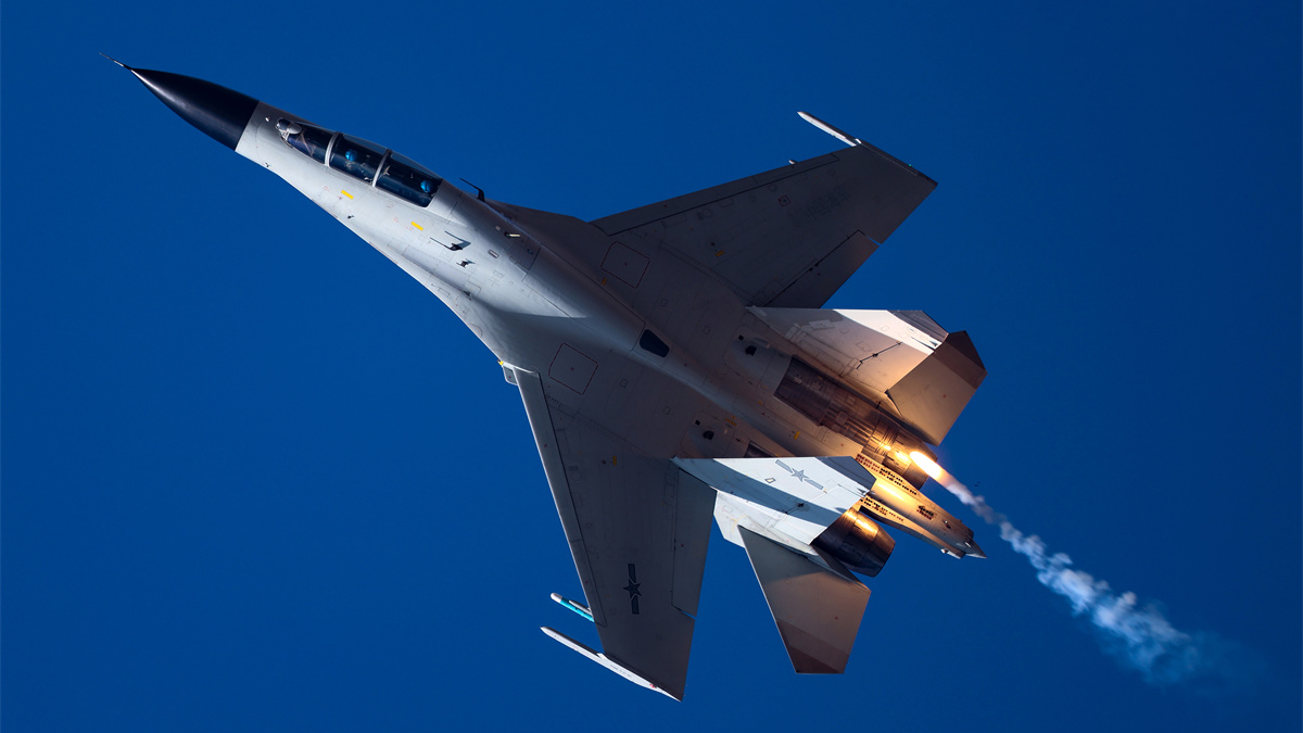 Naval fighter jets in flight training exercise