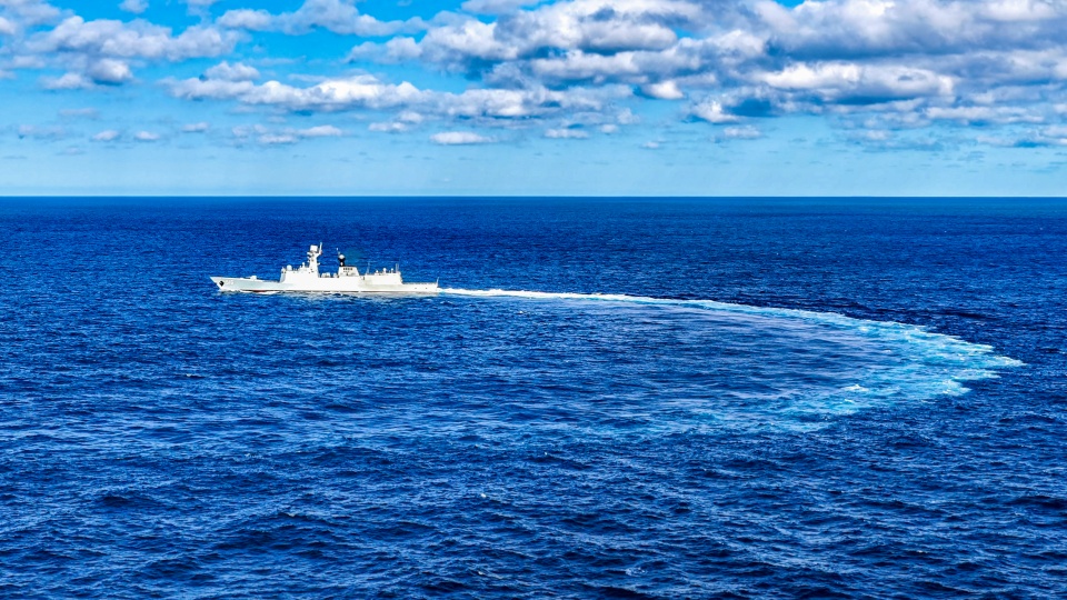 Frigates maneuver at sea