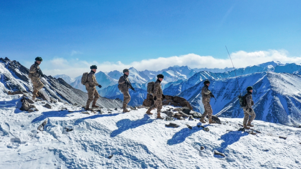 Soldiers patrol in mountainous border area