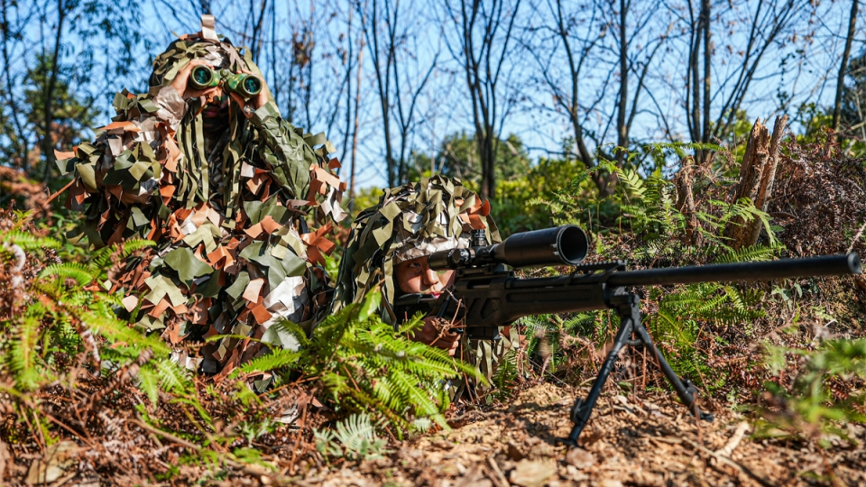 Armed police soldiers train in forest