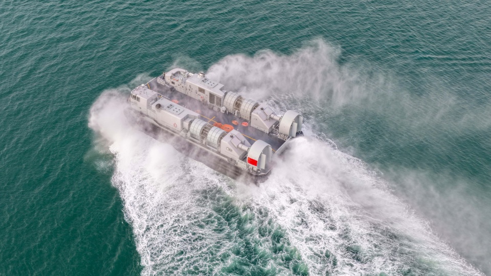 Landing craft air cushion kicks up spray