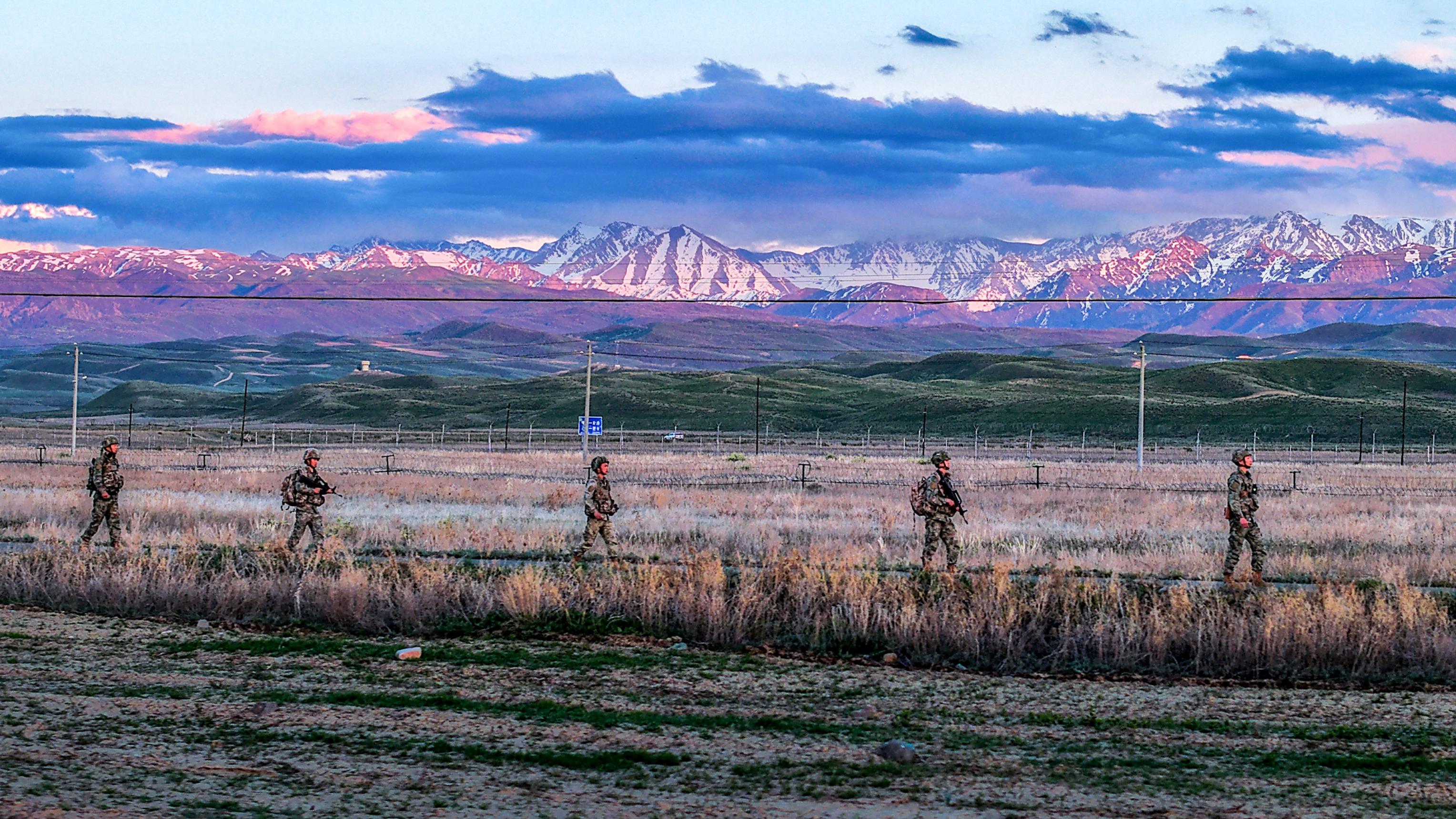 Soldiers patrol in sunset glow
