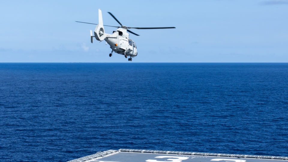 Z-9F anti-submarine helicopters lift off from deck