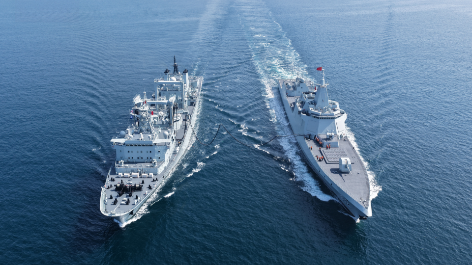 Naval vessels steam in training