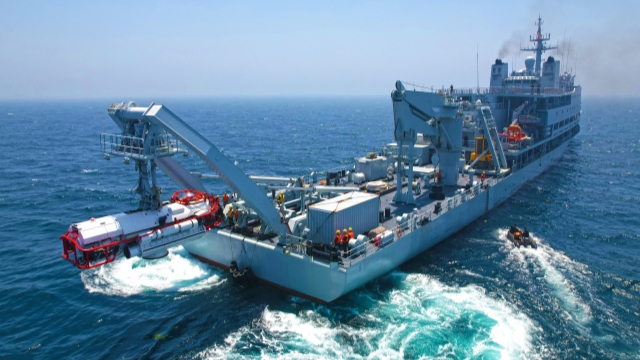 Deep submergence rescue vehicle submerges in sea