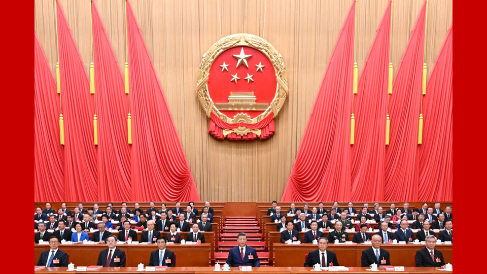 China's national legislature holds closing meeting of annual session