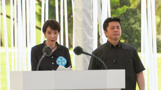 Anti-war demonstrators protest during Japan PM's speech at Okinawa memorial ceremony
