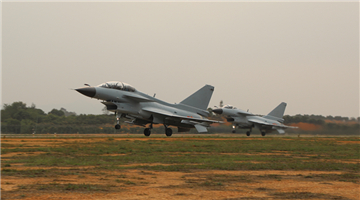 J-10 fighter jets fire rockets at ground targets