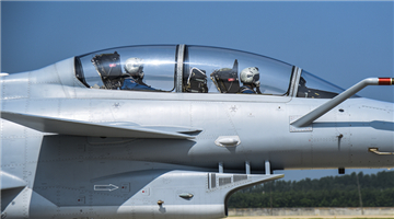 Pilots conduct last-minute inspections before flight
