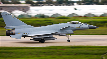 J-10 fighter jets fly under unfavorable meteorology conditions