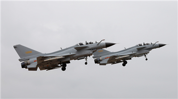 Fighter jets soar to stratosphere above clouds