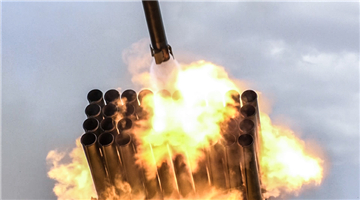 Tracked rocket launchers fire at remote targets