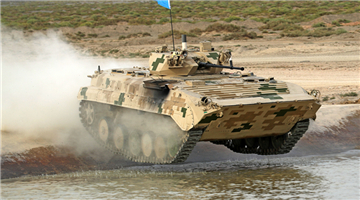 IFVs dash through unsurfaced road