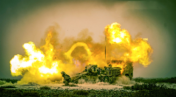 Vehicle-mounted howitzer fires at targets