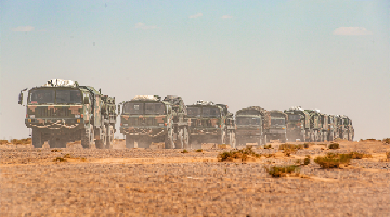 Vehicles maneuver during air defense training