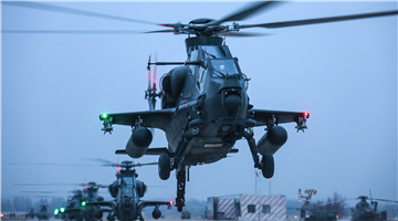 WZ-10 attack helicopter receives power-on inspection at night