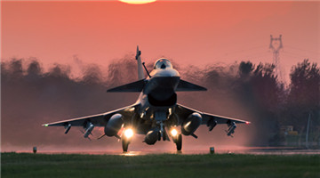 Fighter jet takes off in nightfall
