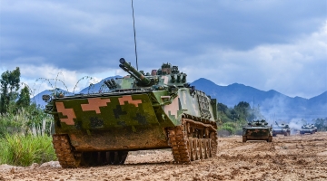 Armored vehicles maneuver to designated areas