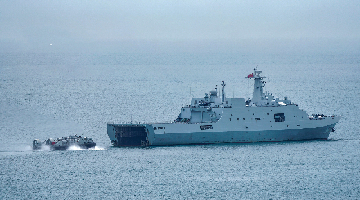 Air cushion landing craft disembarks from dock landing ship