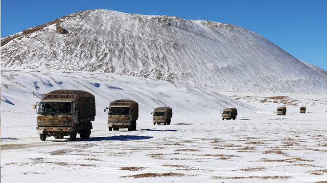 Main battle tanks rumble through snowfield