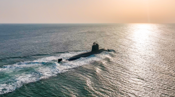 Submarine steams in sea