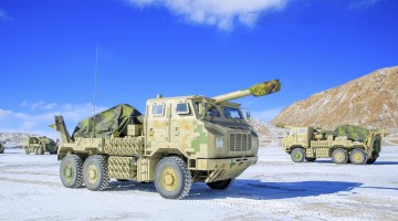 Truck-mounted artilleries maneuver to assembly area