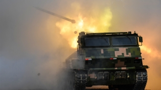 Vehicle-mounted multiple launch rocket system fires at mock target 