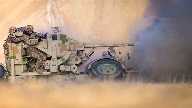 Soldiers operate anti-aircraft artillery in live-fire test