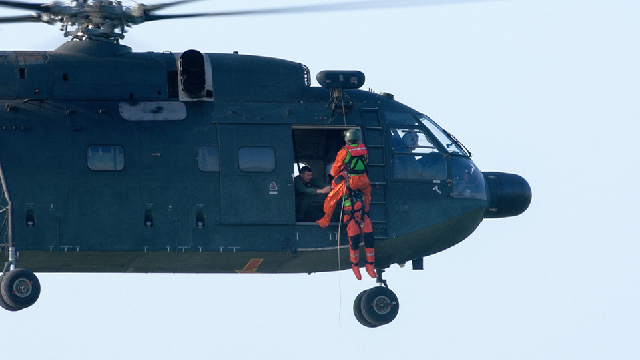 Z-20 hovers above water in rescue training