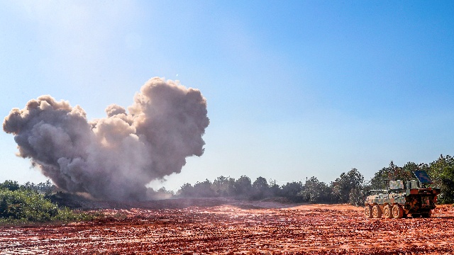 Minesweeping vehicle fires minesweeping explosive device