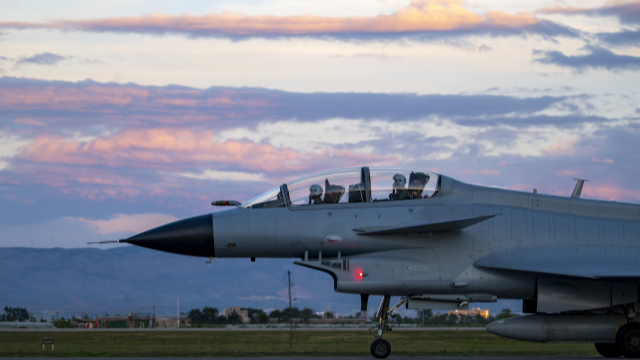 Fighter jets take off at twilight