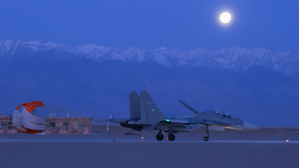 J-16 fighter jet in nighttime training