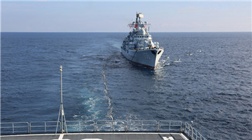 Naval vessels conduct replenishment-at-sea