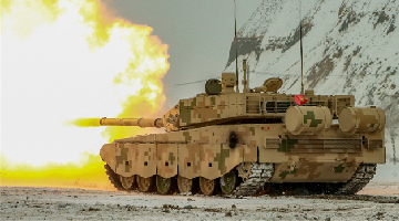 Main battle tank fires at mock targets on plateau