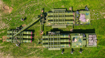 Soldiers load air-defense missiles in field