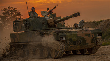 Main battle tanks fire at night