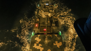 Amphibious armored vehicles engage in night training