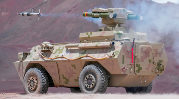 Armored vehicle fires anti-tank missiles in drill