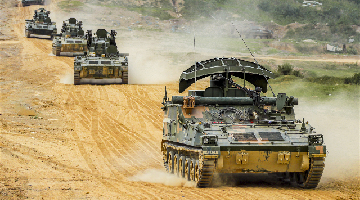 Armored vehicles in maneuver