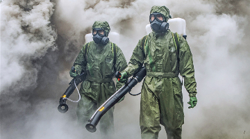Chemical defense soldiers decontaminate hazardous area
