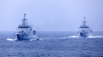 Naval vessels sail on sea
