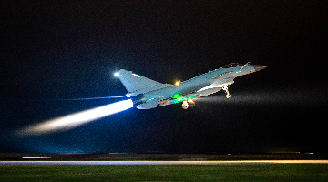 Pilot inspects exhaust nozzle before taking off